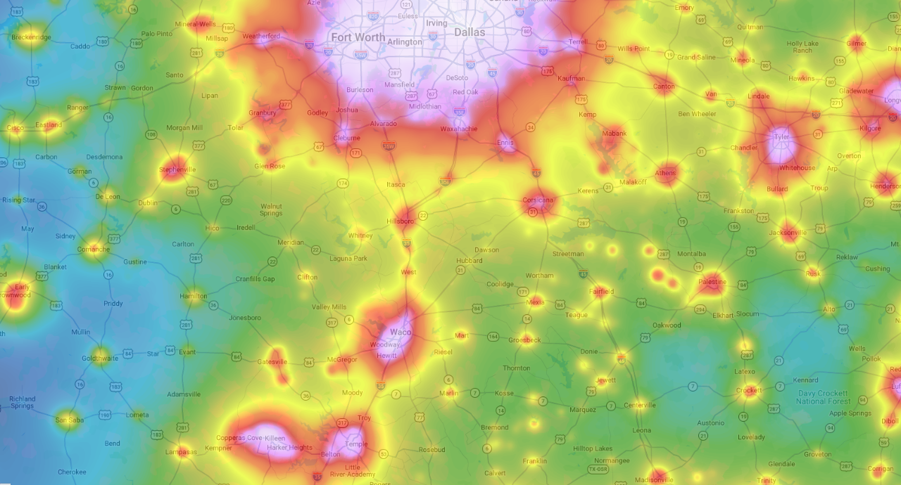 Light pollution map of central Texas showing Dallas-Fort Worth as a large bright dome, Waco as a smaller dome, and Hubbard situated in a relatively dark green-to-yellow transition zone between them. Mexia and Groesbeck each show small yellow-orange pockets of elevated light pollution.